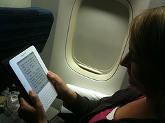Shelly reading her Kindle on an airplane